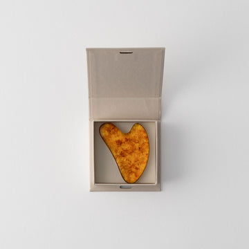 CARELIKA Amber Gua Sha Sculpting Stone in a box